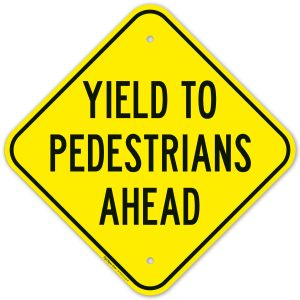 Yield To Pedestrians Ahead Sign